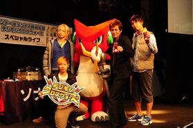 Shoutmon mascot with singers Sonar Pocket & Wada Koji